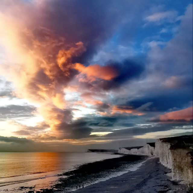a sunset over a beach
